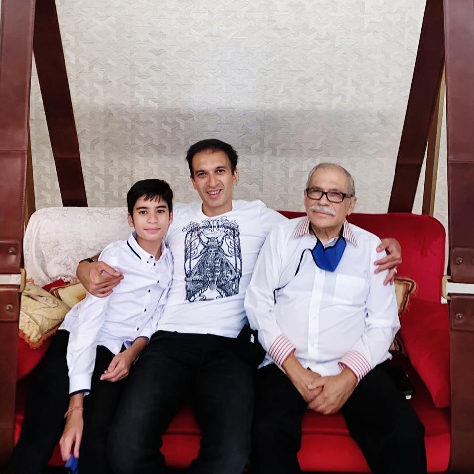 Happily sandwiched between the two most peaceful people on earth, my father and my son!